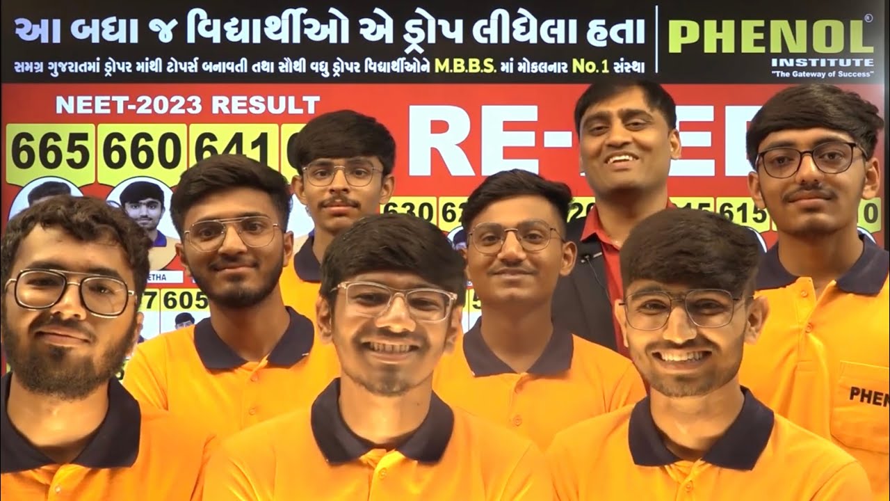 NEET-2023 results board at The Phenol Institute, Rajkot — drop-year cohort scores ranging from 546 to 665.
